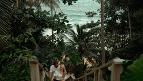 Tourists standing on the wooden Bridge in the Central of Thailand